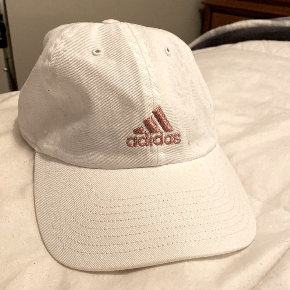White Adidas women’s hat, Adidas logo is gold. Nice looking hat, never worn
